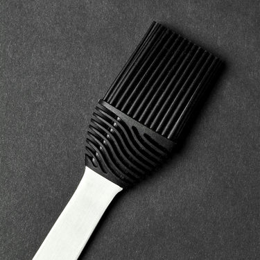 A closeup of the brush bristles of the HexClad BBQ braiser.