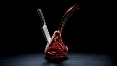 Steak with a HexClad Chef Knife stuck in it