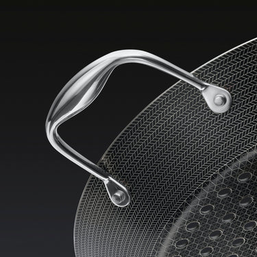 A close up of the handle of the HexClad 12&quot Hybrid BBQ Grill Pan
