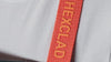 A close-up of the red strap of a HexClad apron.